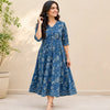 Indian woman wearing a blue floral block print dress in a lifestyle model shoot